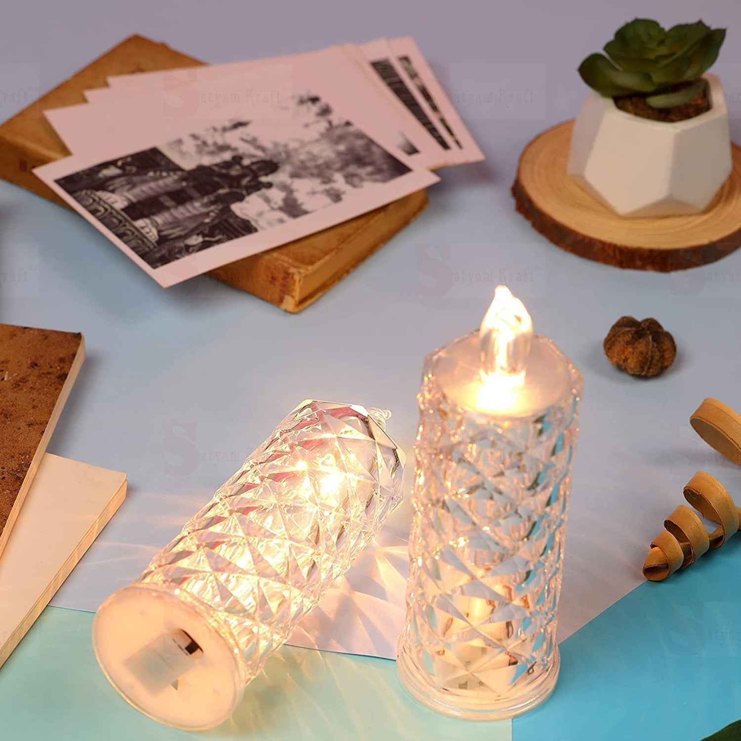 Flameless rose candle with an elegant transparent acrylic base, perfect for festive decorations. Flameless rose candle with an elegant transparent acrylic base, perfect for festive decorations.